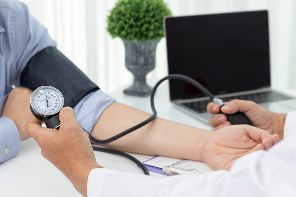 patient-having-blood-pressure-checked-by-doctor