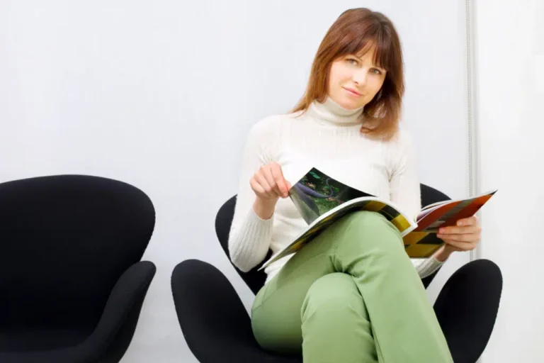Woman-reading-magazine-in-waiting-room