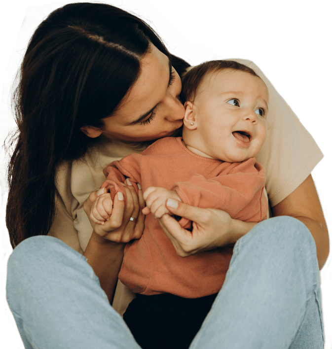 Mom kissing healthy baby